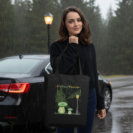 woman holding its frog weather eco tote bag