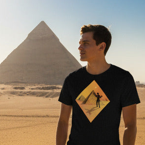 Person wearing a black t-shirt with a graphic design in front of a pyramid.