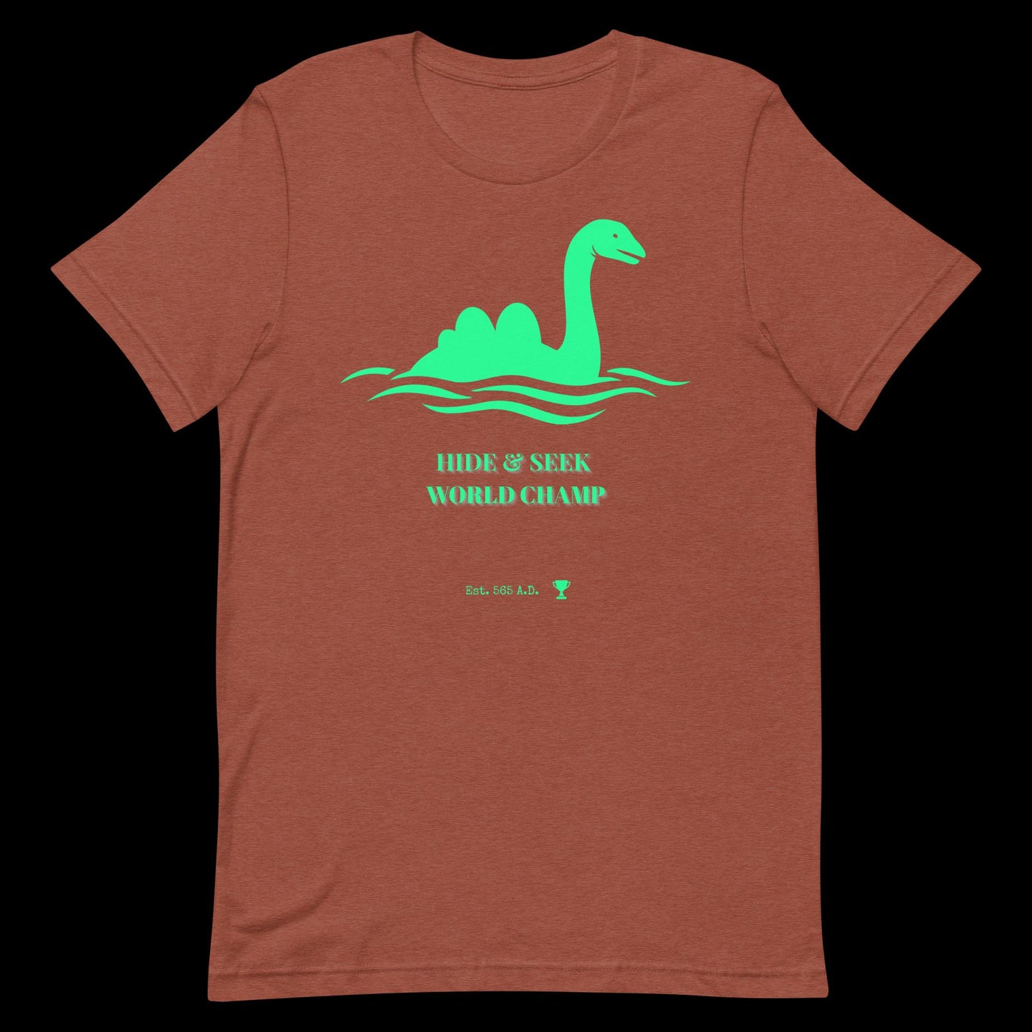 Nessie Hide and Seek World Champ cryptid graphic tee — Loch Ness Monster champion design on heather clay — Stitch and Sigil