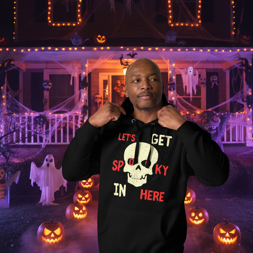 man wearing lets get spooky hoodie