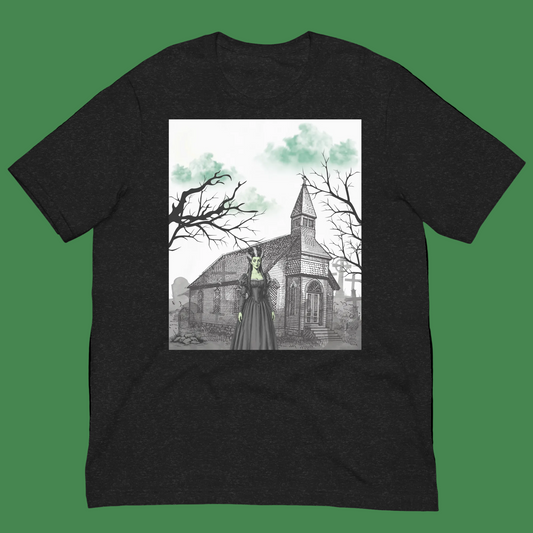 A black heather crewneck t-shirt featuring a square graphic print on the front. The graphic depicts a gothic scene with a stone church, bare trees, and a figure in a long dark dress with a glowing green collar, set against a plain white background.