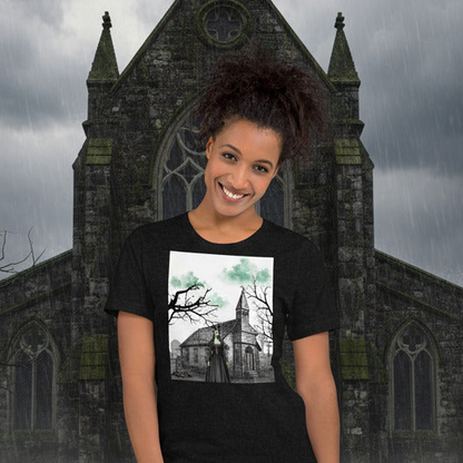 Person wearing a black t-shirt with a church design in front of a gothic-style building.