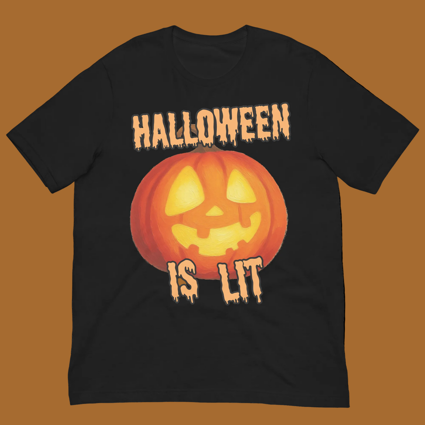 A black short-sleeve crewneck t-shirt featuring a Halloween graphic with a glowing orange jack-o'-lantern and the dripping text 'HALLOWEEN IS LIT' in orange and yellow.