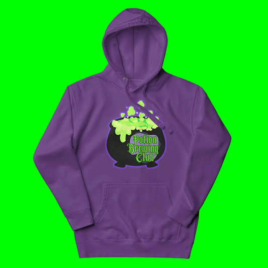 A purple pullover hoodie featuring a graphic of a black cauldron filled with bright green slime, with the text 'Potion Brewing Club' in green and purple