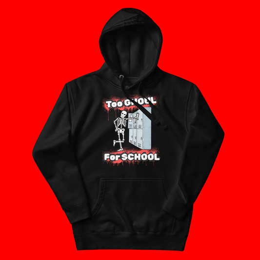A black pullover hoodie with a graphic print on the front showing a skeleton standing next to school lockers under the text 'Too Ghouly For School' in white and red dripping font.