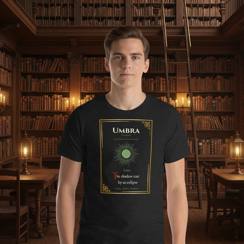 Umbra Lost Lexicon rare word graphic tee — gold manuscript eclipse design on black heather — Stitch and Sigil