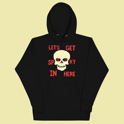 hoodie with text lets get spooky in here centered around a skull