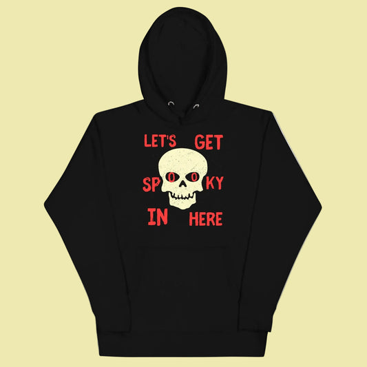 hoodie with text lets get spooky in here centered around a skull