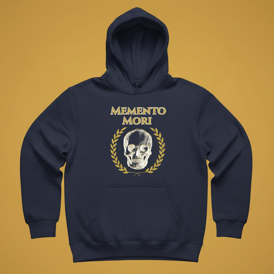 A navy blue pullover hoodie with a front graphic featuring the text 'MEMENTO MORI' in gold, a white skull, and a gold laurel wreath, displayed against a solid mustard yellow background.