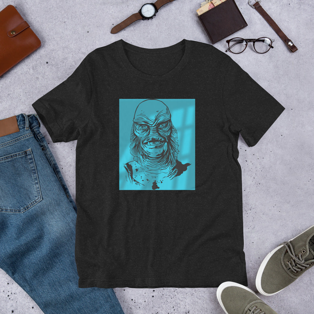 Shot in the Dark Creature glow in dark graphic tee — lagoon creature design on black heather — Stitch and Sigil