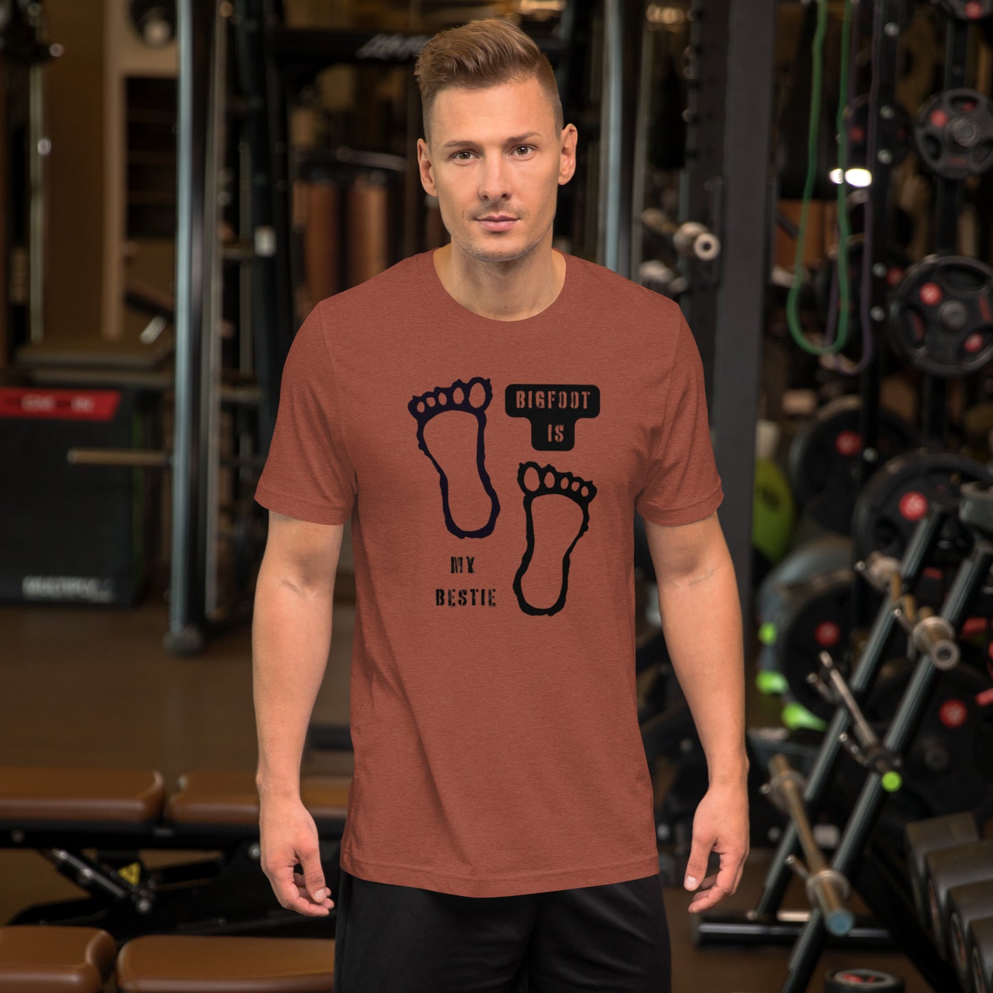 Bigfoot Is My Bestie cryptid graphic tee — Sasquatch bestie design on heather clay front view — Stitch and Sigil