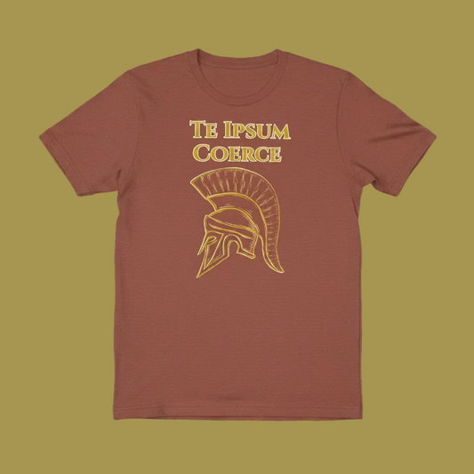 A short-sleeve crewneck t-shirt in a muted terracotta or rust color, featuring a gold graphic of a Spartan helmet and the text 'TE IPSUM COERCE' printed on the chest, set against a solid black background.